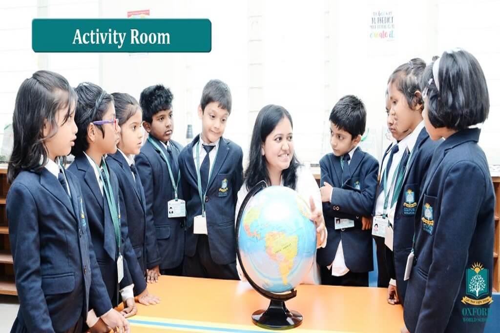 teacher teaching students at activity room