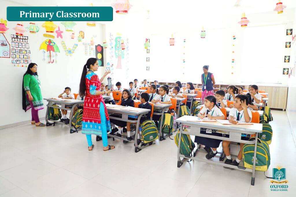 teachers teaching to primary school students